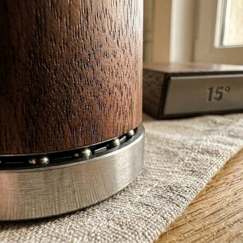 Solid walnut grain meeting brushed steel on the body of the Honewood sharpener